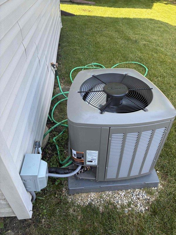 Responded to callback for recent installation not maintaining desired temperature of 71°F, remaining at 74°F throughout the day. Performed system inspection of outdoor condenser unit and electrical components, verified capacitor operation and electrical connections, documented equipment condition with photos. Unit operational at time of service with all components functioning within normal parameters.
