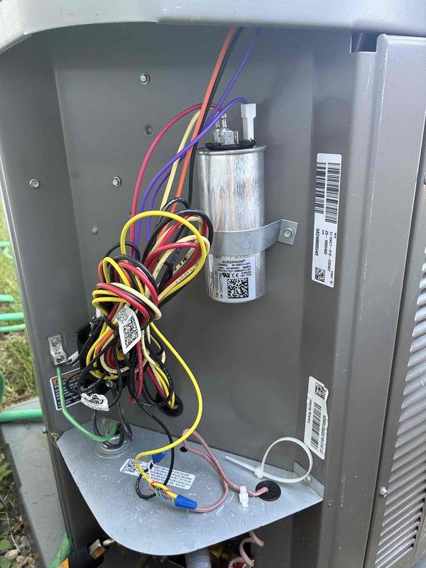 Responded to callback for recent installation not maintaining desired temperature of 71°F, remaining at 74°F throughout the day. Performed system inspection of outdoor condenser unit and electrical components, verified capacitor operation and electrical connections, documented equipment condition with photos. Unit operational at time of service with all components functioning within normal parameters.