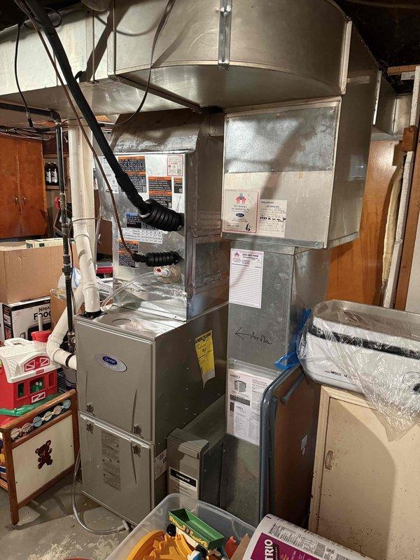 Completed installation of new air conditioning system and evaporator coil to replace existing failed equipment. Removed old AC unit and coil, installed new Carrier HVAC system with matching evaporator coil in basement utility area, connected all necessary ductwork including plenum sections and flexible ducts, verified proper refrigerant charge and airflow, tested system operation for cooling functionality, and confirmed all safety labels and manufacturer specifications were properly displayed on equipment.