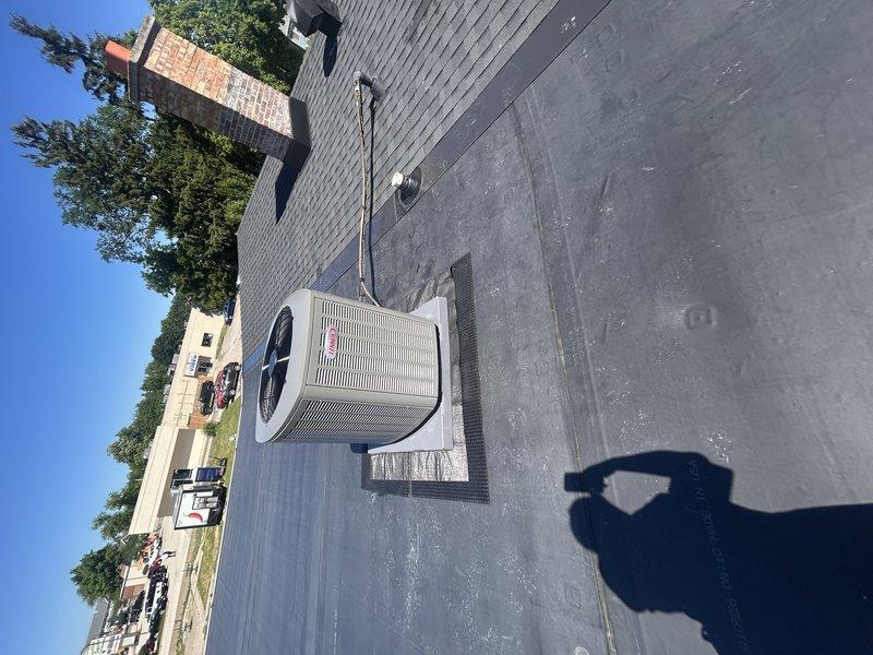 Completed full HVAC system installation including new Lennox air conditioning condenser unit and evaporator coil on flat rubber roof. Utilized crane service for rooftop equipment placement, installed protective rubber underlayment beneath equipment pad to preserve existing rubber roofing membrane, and replaced refrigerant line set with proper insulation while maintaining existing roof flashing integrity. System tested and operational upon completion.