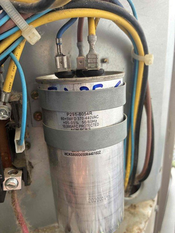 Responded to after-hours no cooling call on 10+ year old unit. Upon arrival, performed electrical diagnostics and identified failed dual-run capacitor (80+5 MFD, 370-440VAC). Verified capacitor failure using clamp meter, which showed improper readings consistent with capacitor degradation. Replaced defective capacitor with new unit meeting OEM specifications. Tested system operation and confirmed proper amperage draw on compressor and condenser fan motor circuits. Unit restored to normal cooling operation.