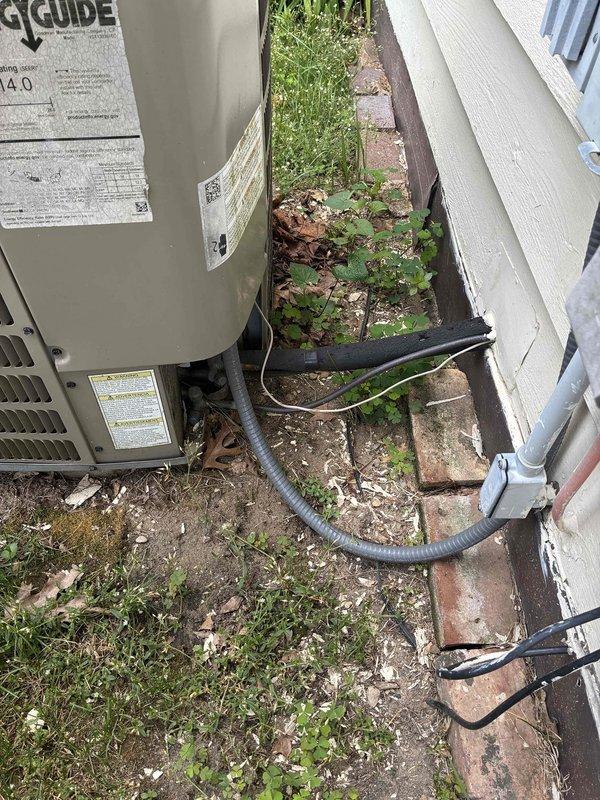 Responded to no cooling complaint on aging residential HVAC system. Upon inspection, found outdoor condensing unit running but not providing cooling to structure. Diagnosed failed dual run capacitor evidenced by severe corrosion and rust on terminal plate, preventing compressor from operating properly. Replaced defective capacitor with manufacturer-specified component, verified proper electrical connections, and tested system operation. Unit restored to normal cooling function with compressor and condenser fan motor running within specifications.