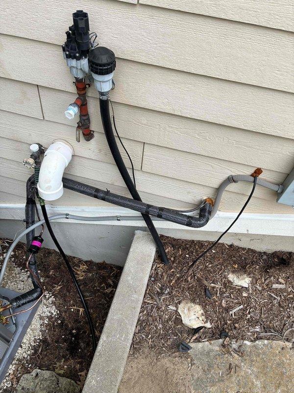 Completed installation of new air conditioning unit and evaporator coil in a congested mechanical space with limited clearance, utilizing a "D" width coil measuring 26.25" tall to accommodate existing ductwork configuration. Reused existing line set buried in ceiling, verified proper refrigerant pressures using manifold gauges, and integrated new equipment with existing 12-year-old furnace and zoned system while working around non-standard filter setup. Confirmed electrical connections at Cutler Hammer panel with 15-amp furnace circuit and 50-amp AC circuit, removed old AC unit, and ensured all components operational before completion.