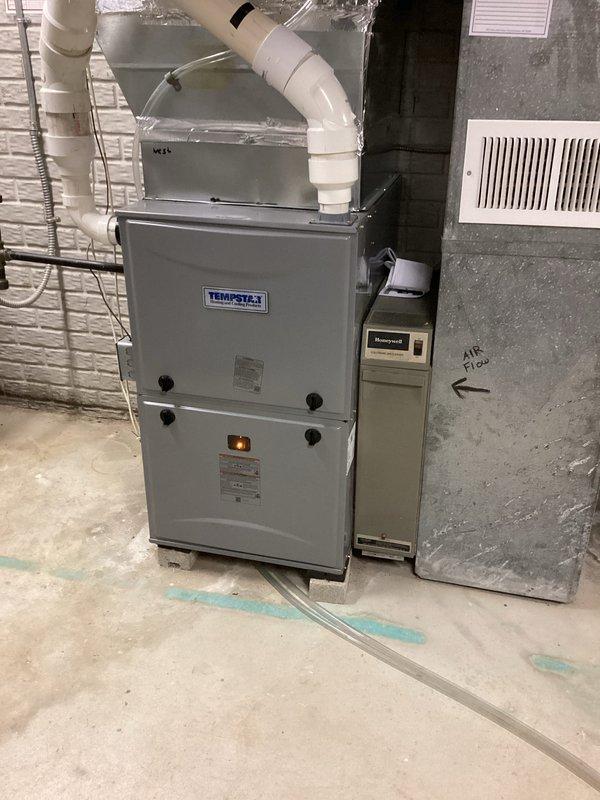 Completed prepaid maintenance visit on residential HVAC system consisting of one boiler and two furnaces. Performed thorough cleaning and operational checks on both furnace units—a Lennox Elite (East zone, installed December 2010) and a Tempstar unit. Inspected all components including heat exchangers, burners, blower assemblies, and condensate drainage systems. Verified proper airflow, tested safety controls, and confirmed all equipment operating within normal parameters. Addressed homeowner inquiry regarding zoning configuration for pool room area; additional specialist visit scheduled to resolve boiler-related zoning concerns. Replaced two 20x25x4 air filters as part of routine maintenance protocol. All accessible ductwork, PVC condensate lines, and control systems inspected and found in satisfactory condition with no immediate repairs required.