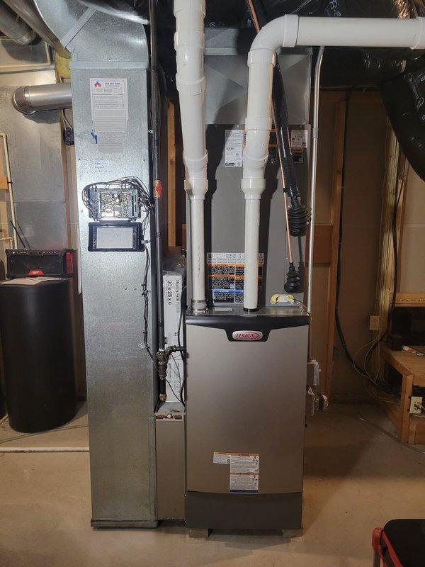 Completed full HVAC system replacement for 2,800 square foot residential property with 4-zone configuration. Removed existing furnace, air conditioning unit, and evaporator coil, then installed new Lennox furnace with variable speed blower, outdoor condensing unit, and matching evaporator coil. Replaced zone control board with SLP-compatible model to maintain functionality across all four zones. Installed new 20-foot refrigerant line set with proper insulation and vacuum procedures. Replaced all 2-inch PVC condensate drain piping, running approximately 20 feet per drain line to ensure proper drainage and code compliance. 

Electrical work included installation of new Cutler Hammer/Eaton service panel with dedicated 60-amp circuit for air conditioning unit and 15-amp circuit for furnace, with appropriate disconnect switches and proper conduit routing along exterior siding. Reused existing return air drop and media air cleaner cabinet to integrate with new system. Removed bypass humidifi