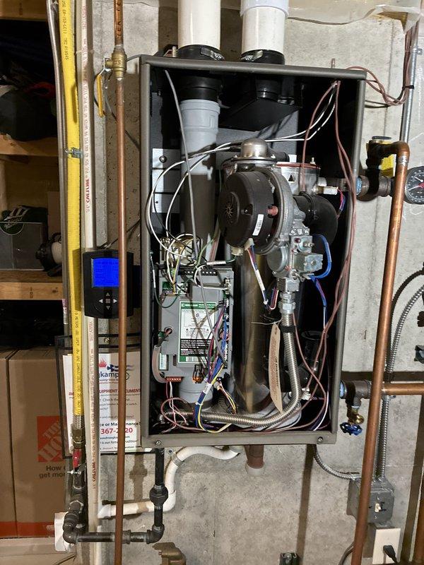 Completed prepaid boiler tuneup and maintenance inspection. Verified pressure gauge readings within normal operating range, inspected internal components including blower assembly, heat exchanger, and all electrical connections. Checked gas line connections, venting system, and all plumbing connections for proper operation. All systems operating as designed with no issues identified. Unit is functioning properly and ready for continued service.