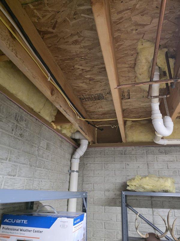 Installed a NEMA 14-50 outlet in the front corner of the garage for electric vehicle charging. Ran approximately 25 feet of electrical conduit and wiring through the open basement area to the new outlet location. Removed the existing EV breaker from the main electrical panel and replaced it with a Cutler-Hammer 250-amp breaker to properly support the new circuit requirements.