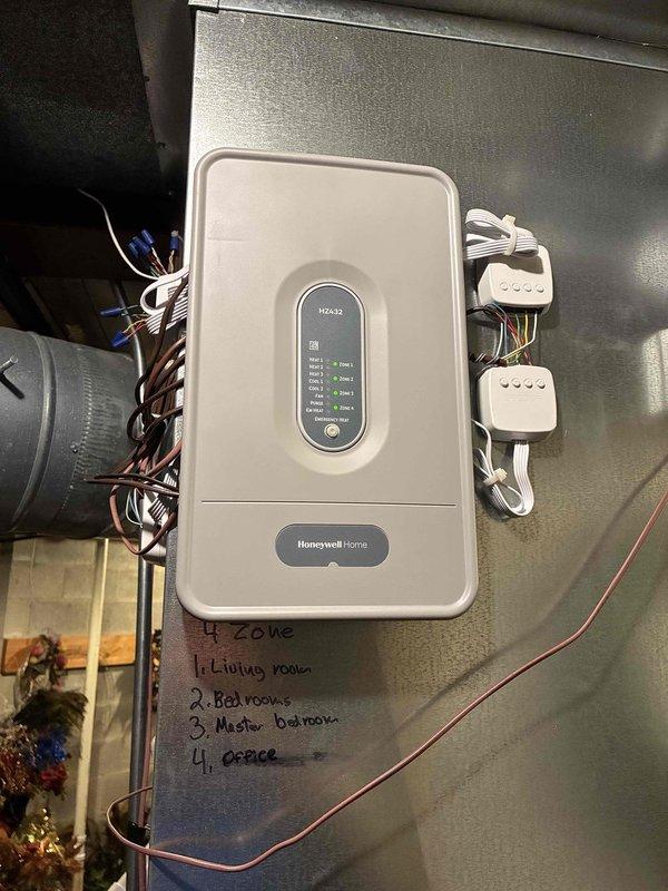 Installed complete 4-zone HVAC system including Honeywell HZ432 zoning control panel, multiple aluminum blade bottom mount dampers (8x10, 8x12, and 8x14), transformers, and Ecobee Smart programmable thermostats with add-a-wire kits to restore heating and cooling functionality. Configured zone control for living room, bedroom, master bedroom, and office areas with motorized dampers integrated into existing ductwork plenum system. System tested and operational upon completion.
