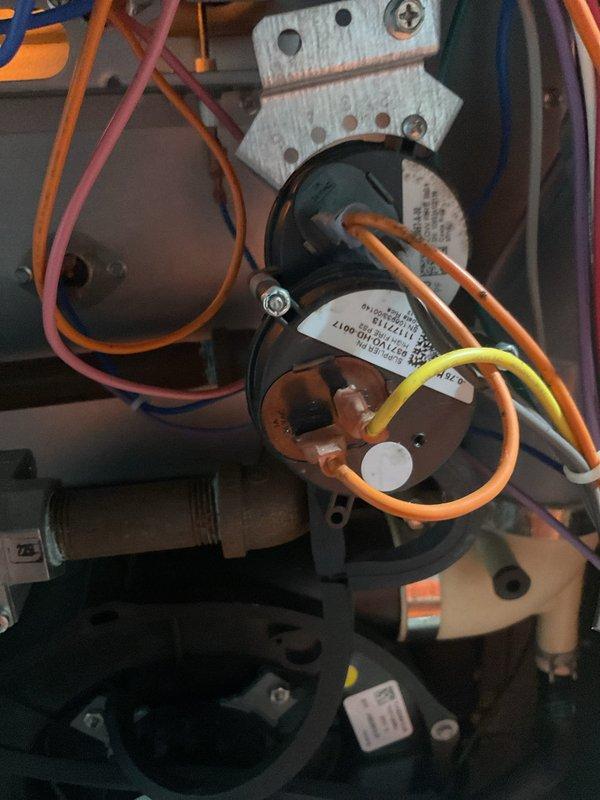 Responded to no-heat emergency call and performed comprehensive furnace tune-up and maintenance service. Diagnosed faulty pressure switch as cause of heating system failure; unit had temporarily resumed operation but pressure switch replacement was completed as preventive measure to ensure reliable operation. Conducted complete seasonal maintenance including inspection of blower motor assembly, electrical connections, and all system components. Verified proper wire routing and connections throughout control system, inspected capacitor and mounting hardware, and confirmed all safety controls functioning correctly. Unit returned to full operational status and found to be in good overall condition following service completion.