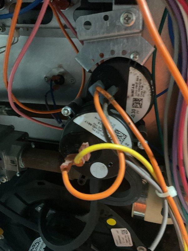 Responded to no-heat emergency call and performed comprehensive furnace tune-up and maintenance service. Diagnosed faulty pressure switch as cause of heating system failure; unit had temporarily resumed operation but pressure switch replacement was completed as preventive measure to ensure reliable operation. Conducted complete seasonal maintenance including inspection of blower motor assembly, electrical connections, and all system components. Verified proper wire routing and connections throughout control system, inspected capacitor and mounting hardware, and confirmed all safety controls functioning correctly. Unit returned to full operational status and found to be in good overall condition following service completion.
