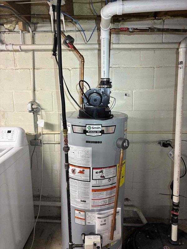 Replaced anode rod on A.O. Smith ProLine XE water heater. Removed old corroded anode rod and installed new replacement rod from inventory to restore corrosion protection and extend tank life. Verified proper installation and system operation upon completion.