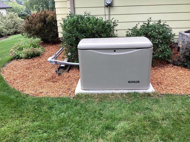 Returned to site for customer training on operation of newly installed 14KW Kohler air-cooled home standby generator system. Provided comprehensive instruction on generator controls, automatic transfer switch operation, and system monitoring. Reviewed maintenance requirements and warranty coverage details with homeowner.

Installation included one Kohler model 14RESV generator with steel cabinet mounted on concrete pad on left side of residence, one 16-space automatic transfer switch installed in wall adjacent to main electrical panel, complete line and low voltage wiring, battery, and carburetor heater. Natural gas supply line installed with all necessary pipe and fittings to fuel source, with exterior gas piping painted gray per specifications. System tested and verified operational. Customer advised that electrical service upgrade required by utility company for gas meter before final energization. Same-day inspection not required for this phase of work.