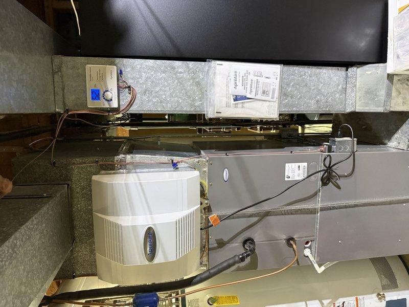 Completed large furnace tune-up and maintenance inspection per agreement terms. Installed customer-provided AA700 control board won at auction, mounting unit within existing HVAC control panel and connecting all necessary wiring to terminal blocks and system components. Verified proper operation of Aprilaire humidifier, air handler unit, refrigerant lines, and all electrical connections throughout the attic-mounted system.