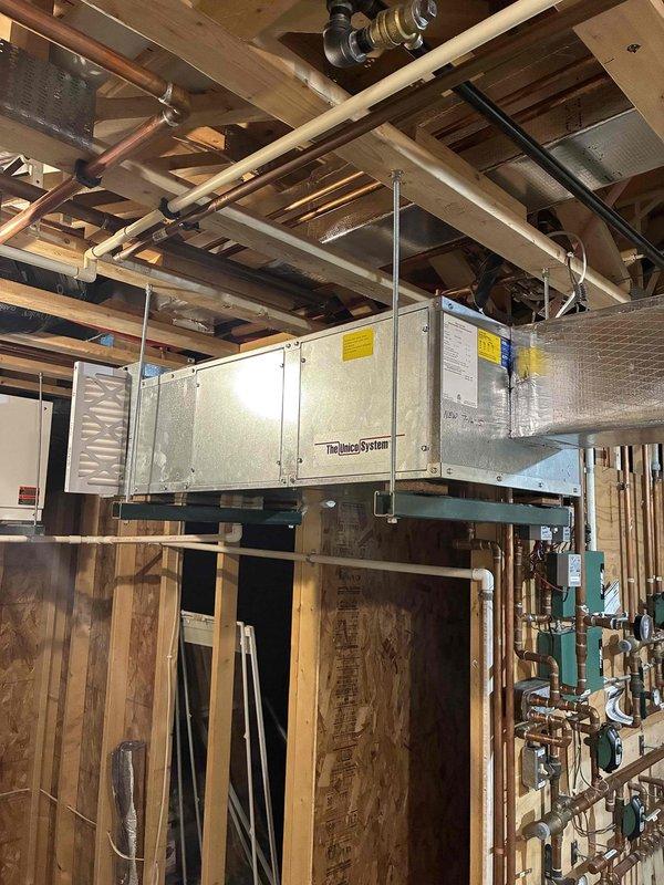 Responded to no cooling call on basement air handler system over 10 years old. Upon arrival, inspected Themeco air handler unit and outdoor condensing unit. System was found to be out of manufacturer warranty. Performed diagnostic evaluation of both indoor and outdoor components, documented equipment condition with photos showing air handler installation in basement and outdoor condenser unit placement. Advised customer of system age and warranty status, discussed repair versus replacement options given the unit's age and lack of recent maintenance history. Customer to determine course of action for restoring cooling operation to the system.