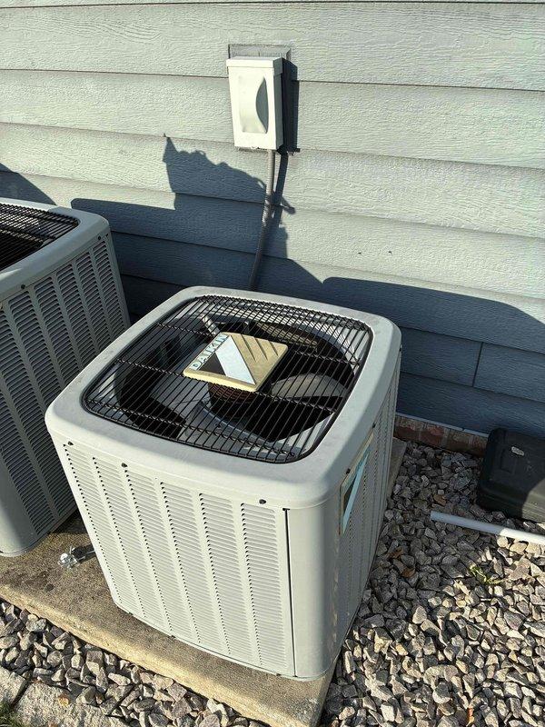Responded to no cooling call on basement air handler system over 10 years old. Upon arrival, inspected Themeco air handler unit and outdoor condensing unit. System was found to be out of manufacturer warranty. Performed diagnostic evaluation of both indoor and outdoor components, documented equipment condition with photos showing air handler installation in basement and outdoor condenser unit placement. Advised customer of system age and warranty status, discussed repair versus replacement options given the unit's age and lack of recent maintenance history. Customer to determine course of action for restoring cooling operation to the system.