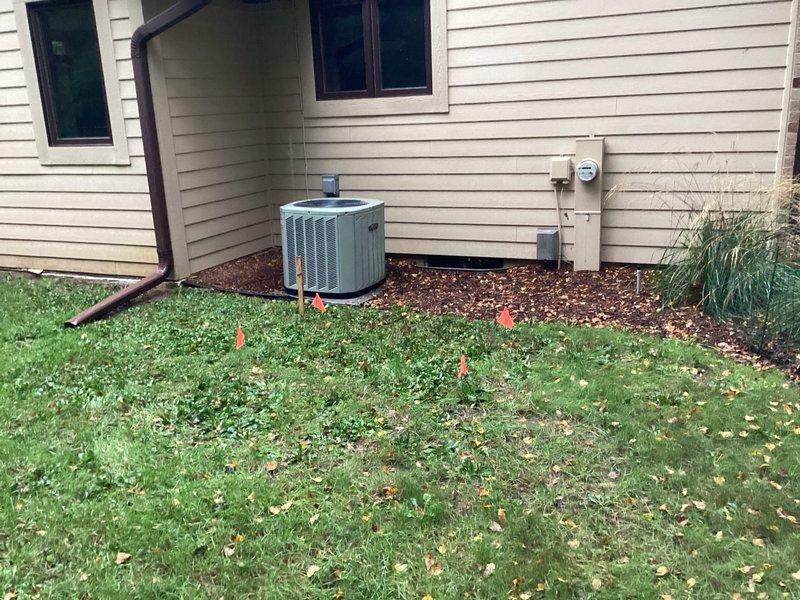 Installed a 26kW Kohler 26RCA air-cooled standby generator on a new concrete pad at the marked location along the side of the structure, with a 200A service-rated automatic transfer switch mounted adjacent to the meter. Completed line and low-voltage wiring, grounding and bonding, and separation of grounds and neutrals in the main panel, and fitted the battery and carburetor, oil, and regulator heaters. Ran gas piping and fittings for the final propane connection, with the supply line to be brought within 5' of the unit by the propane provider.