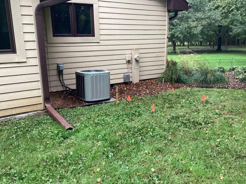 Installed a 26kW Kohler 26RCA air-cooled standby generator on a new concrete pad at the marked location along the side of the structure, with a 200A service-rated automatic transfer switch mounted adjacent to the meter. Completed line and low-voltage wiring, grounding and bonding, and separation of grounds and neutrals in the main panel, and fitted the battery and carburetor, oil, and regulator heaters. Ran gas piping and fittings for the final propane connection, with the supply line to be brought within 5' of the unit by the propane provider.