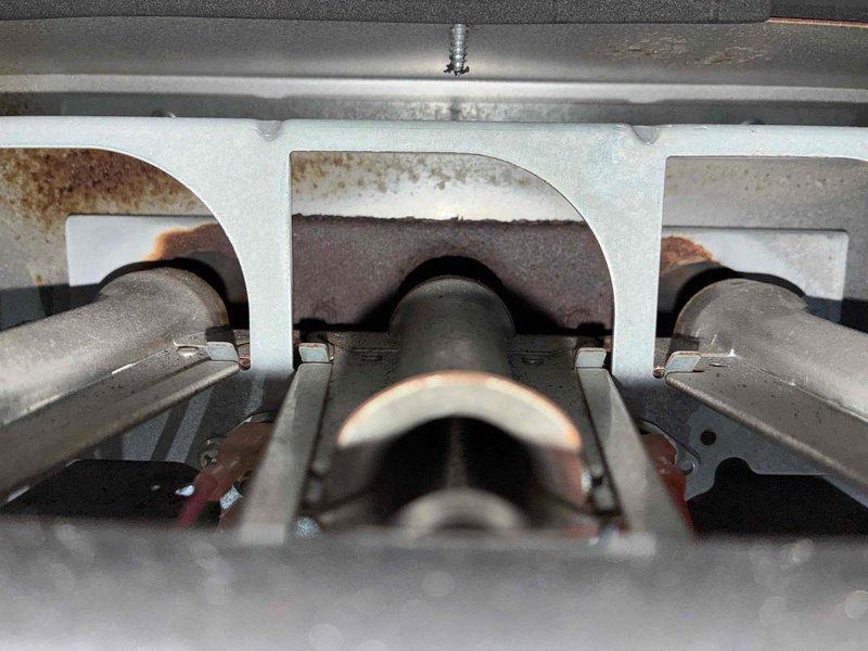 Performed annual fall tune-up and plan renewal on a Goodman gas furnace, inspecting the burner assembly, combustion chamber, venting, and 20x25x4 filter. Noted heavy corrosion and rust staining on the combustion chamber walls and burner area, which should be monitored or evaluated further for heat exchanger integrity.