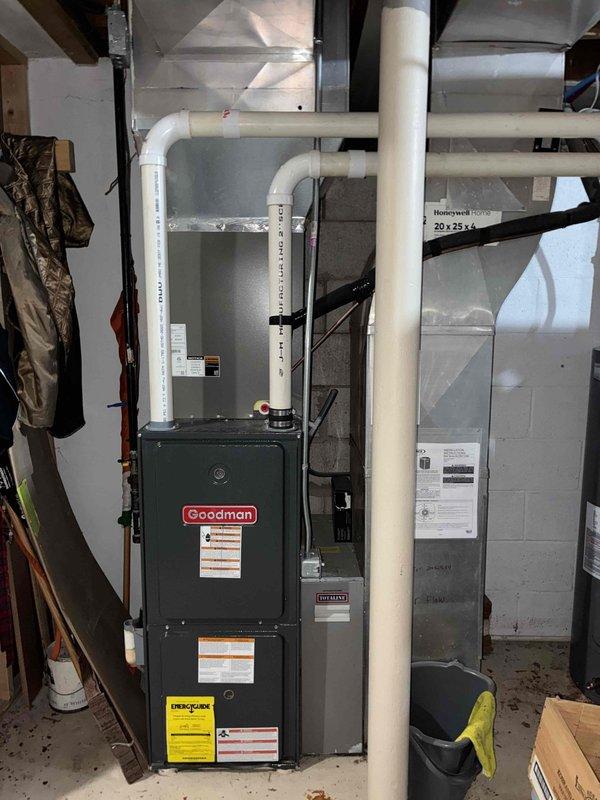 Performed annual fall tune-up and plan renewal on a Goodman gas furnace, inspecting the burner assembly, combustion chamber, venting, and 20x25x4 filter. Noted heavy corrosion and rust staining on the combustion chamber walls and burner area, which should be monitored or evaluated further for heat exchanger integrity.