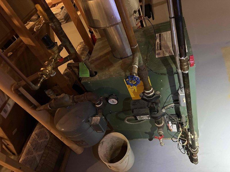 Performed the annual fall tune-up on the gas-fired boiler, inspecting the burner assembly, flue and draft hood venting, circulator pump, expansion tank, pressure gauge, and associated piping and valves. The system was found to be operating normally with no leaks, corrosion, or deficiencies noted, and the customer was enrolled in the maintenance club program.