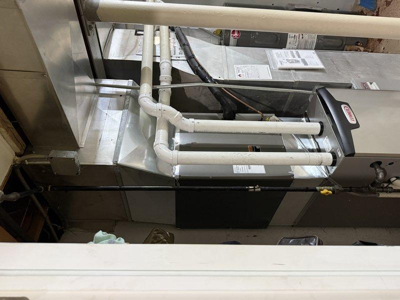 Installed a new Lennox gas furnace in the utility closet, connecting the supply and return ductwork and plenum transitions. Routed and secured PVC intake and exhaust venting and connected the gas supply with a shutoff valve. Completed the electrical connections, mounted the required warning and specification labels, and left the installation instructions with the equipment.