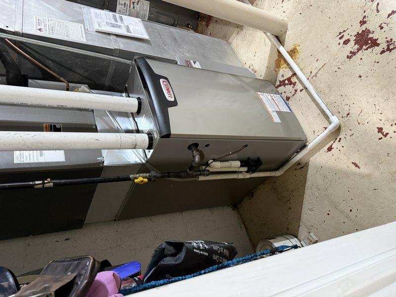 Installed a new Lennox gas furnace in the utility closet, connecting the supply and return ductwork and plenum transitions. Routed and secured PVC intake and exhaust venting and connected the gas supply with a shutoff valve. Completed the electrical connections, mounted the required warning and specification labels, and left the installation instructions with the equipment.