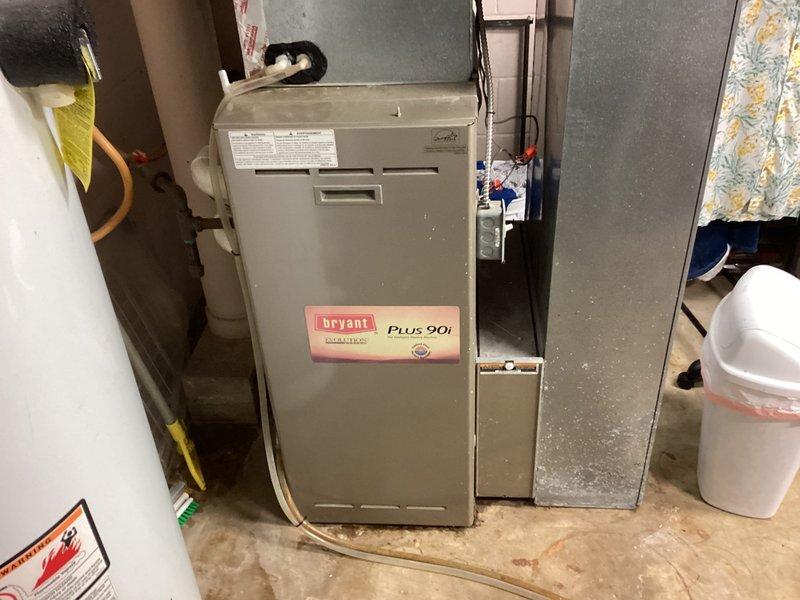 Performed a full inspection of a leaking Richmond Integra gas tanked water heater and found moisture and staining on the concrete floor at the base of the unit, confirming the tank has failed and is beyond economical repair. Recommended replacement of the water heater and provided a quote for the replacement unit.