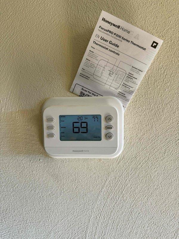 Removed the existing furnace, air conditioner, and evaporator coil and installed a complete new split system consisting of a furnace, AC condensing unit, and matching coil. Connected the refrigerant lines, charged the system, and verified performance using gauges and a digital thermometer. Installed and configured a new Honeywell Home FocusPRO P200 thermostat, confirmed proper heating operation, and left the system running as designed.