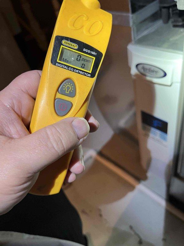 Performed standard BFMA tune-up service on 1-year-old furnace, confirming proper operation. Carbon monoxide testing showed safe levels (0.0 PPM) using General DCO1001 detector. Inspected water heater during service noting proper installation with intact pressure relief valve and no visible issues.