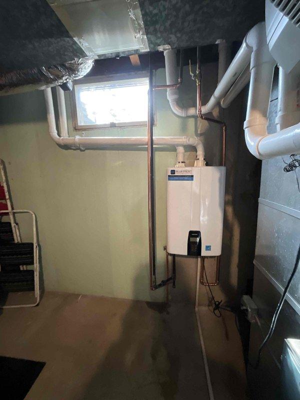 Successfully installed a Navien tankless water heater in the utility room, replacing the previous tank-style unit. Reconfigured existing PVC ventilation pipes to accommodate the new unit and optimize the layout. Connected all necessary copper and PVC supply lines according to manufacturer specifications, ensuring proper function and compliance with installation requirements.