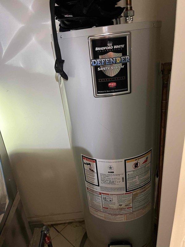 Performed scheduled BFMA Tune Up on a Bradford White Defender water heater (approximately 1+ years old). Conducted carbon monoxide safety testing with digital detector, confirming 0 ppm readings and proper system operation. Visual inspection showed all components in good working condition with proper connections and no leaks observed.