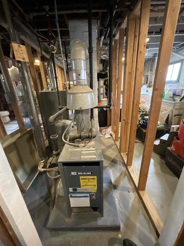 Performed non-member maintenance furnace tune-up on an aging boiler system. Inspected pressure gauge, copper piping, and electrical connections which showed signs of dust accumulation and wear. Customer expressed interest in SpacPak integration rather than mini-split options; provided relevant information regarding compatibility with existing infrastructure.