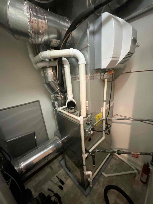 Completed standard BFMA tune-up service on 9-year-old residential HVAC system, performing comprehensive maintenance on two furnaces and connected humidifier. System inspection revealed normal operational condition with all components functioning within specifications after service.