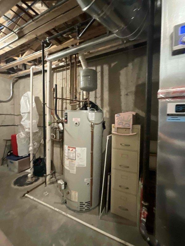 Completed standard BFMA tune-up service on 9-year-old residential HVAC system, performing comprehensive maintenance on two furnaces and connected humidifier. System inspection revealed normal operational condition with all components functioning within specifications after service.