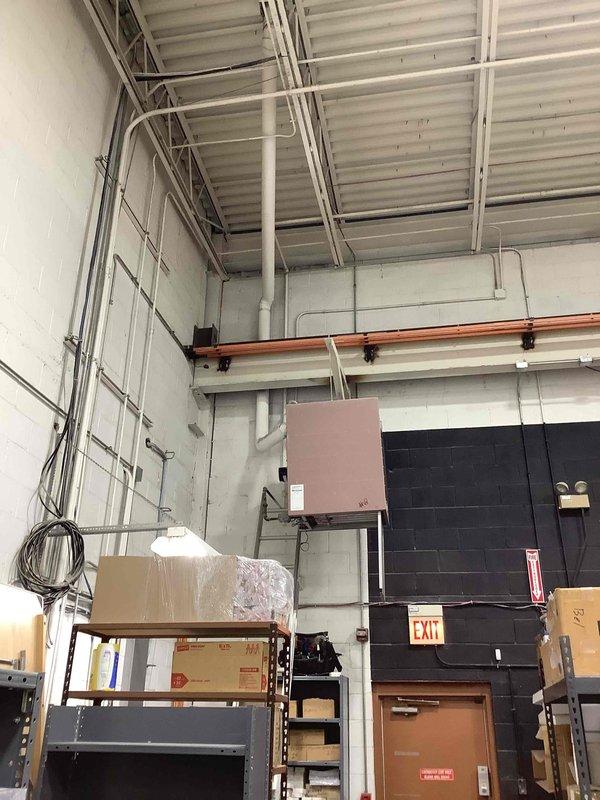 Responded to commercial no heat call for unit #9 that was previously serviced earlier this month. Performed diagnostic inspection of the wall-mounted HVAC system located in the storage/utility area. Accessed unit using ladder to reach the elevated equipment, verified proper operation, and restored heating functionality by adjusting control settings that had been improperly modified.