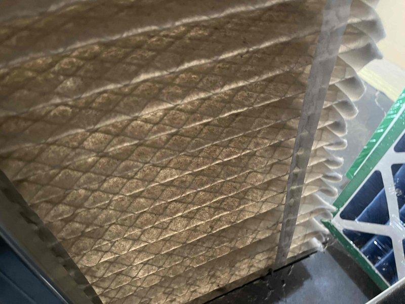 Performed regular BFMA tune-up service on a 4-year-old Lennox furnace system with dual humidifiers. Discovered and replaced severely clogged air filter that was restricting proper airflow and reducing system efficiency. Completed comprehensive maintenance on both furnace units and replaced both humidifier pads as part of the scheduled maintenance protocol.