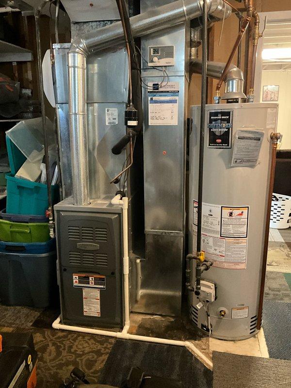 Performed scheduled BFMA Tune Up on 12-year-old furnace and humidifier system. Inspected equipment and found air filter (PAMLICO AIR) with significant dust accumulation requiring replacement. Completed full system inspection including ductwork connections, checked water heater functionality, and verified proper operation of all components after service.