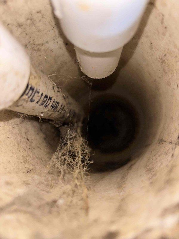 Responded to emergency service call for unusual odor emanating from HVAC vents. Upon inspection, discovered significant dust, cobweb accumulation, and residue buildup in the ventilation system and drain pipe. Performed thorough cleaning of affected components to eliminate the source of the odor.