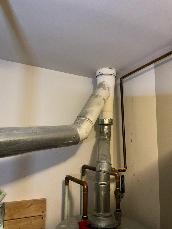 Performed diagnostic inspection of existing furnace system, documenting condition of internal electrical components and control boards. Evaluated connected ventilation infrastructure including metal ductwork, PVC exhaust piping, and associated copper plumbing components. Assessment conducted to determine appropriate replacement options for the aging heating system.