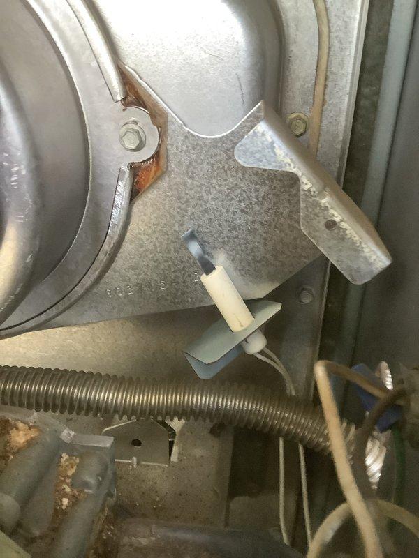 Performed standard maintenance tune-up on 12+ year old furnace. Inspected blower assembly and ignition system, noting minor oxidation on metal components but system functioning within normal parameters. Cleaned and tested all essential components to ensure proper operation for the upcoming heating season.