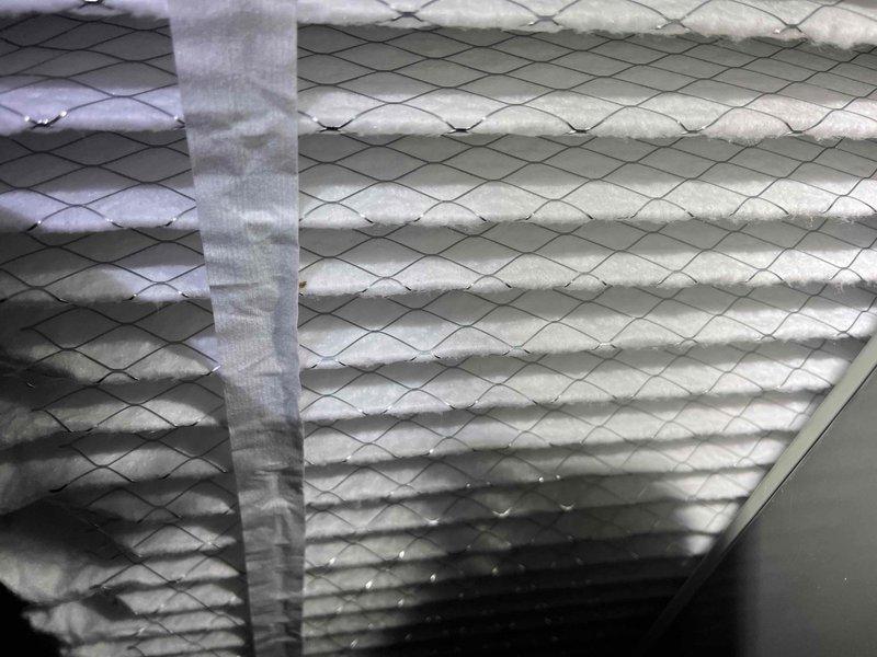 Performed scheduled maintenance service on residential HVAC system. Inspected and evaluated air filter condition, noting the pleated filtration material appeared relatively clean. Conducted carbon monoxide safety test using General DCO1001 detector, confirming readings of 0 ppm with no CO presence detected in the system.