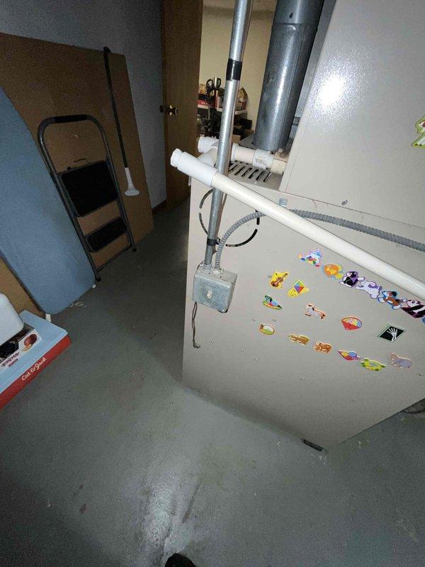 Conducted site assessment for humidifier replacement at client's residence. Inspected existing HVAC system including furnace/air handler unit and associated control wiring. Documented current installation configuration and control board connections for proper replacement specification.