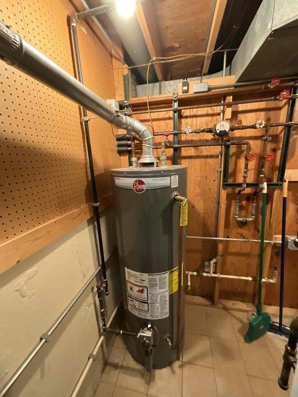 Performed comprehensive BFMA tune-up on 6-year-old furnace system with integrated humidifier in basement utility room. Inspected Rheem water heater, verified proper venting connections and checked all associated plumbing systems for optimal performance. Completed full system diagnostic, cleaned components, and confirmed all electrical connections were secure with system functioning at manufacturer specifications.