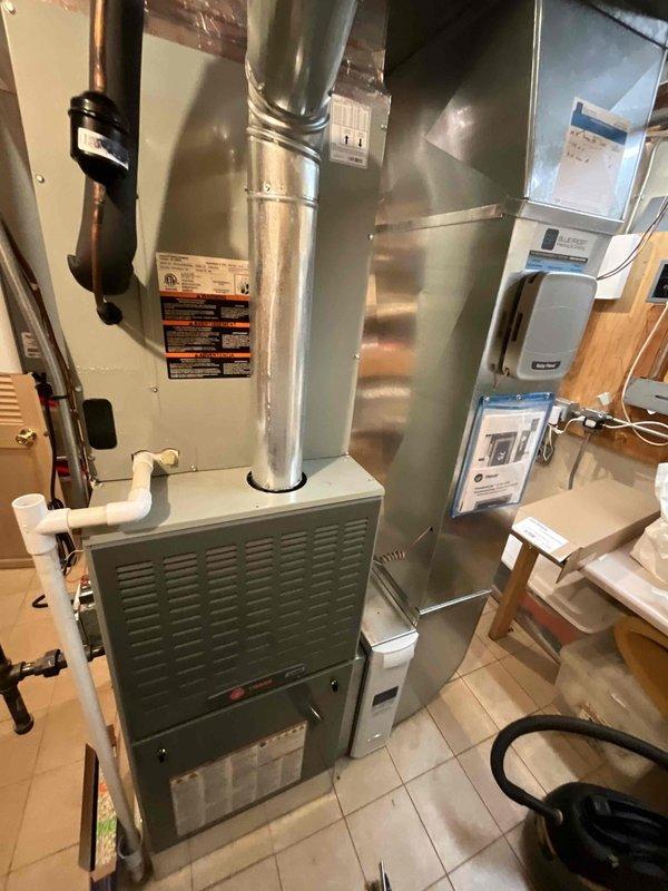 Performed comprehensive BFMA tune-up on 6-year-old furnace system with integrated humidifier in basement utility room. Inspected Rheem water heater, verified proper venting connections and checked all associated plumbing systems for optimal performance. Completed full system diagnostic, cleaned components, and confirmed all electrical connections were secure with system functioning at manufacturer specifications.