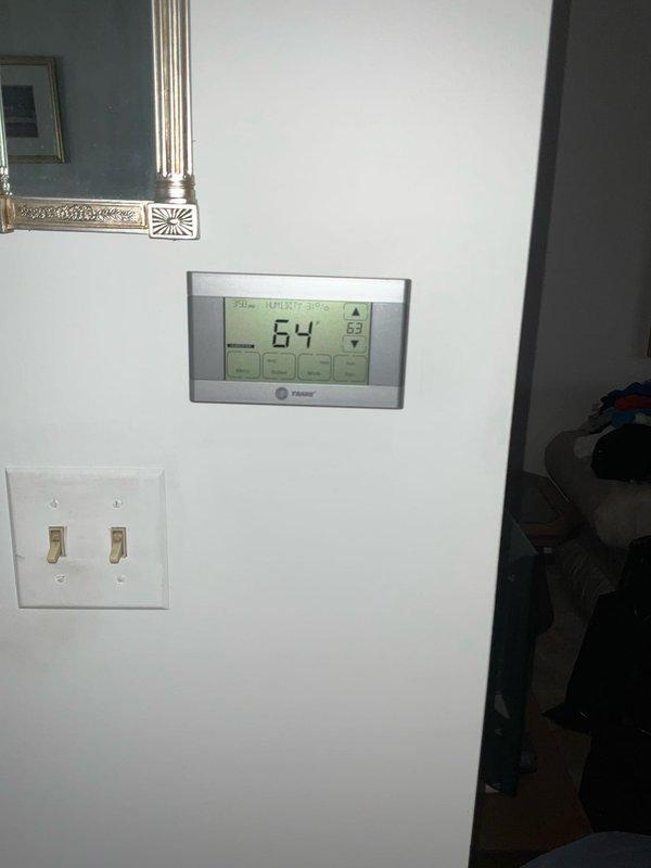 Successfully completed installation of Ecobee6 smart thermostat system, replacing existing Trane thermostat. Installation included main thermostat unit and remote temperature sensor, with part sourced from headquarters as per customer request. System functioning properly with cooling operation verified at completion.