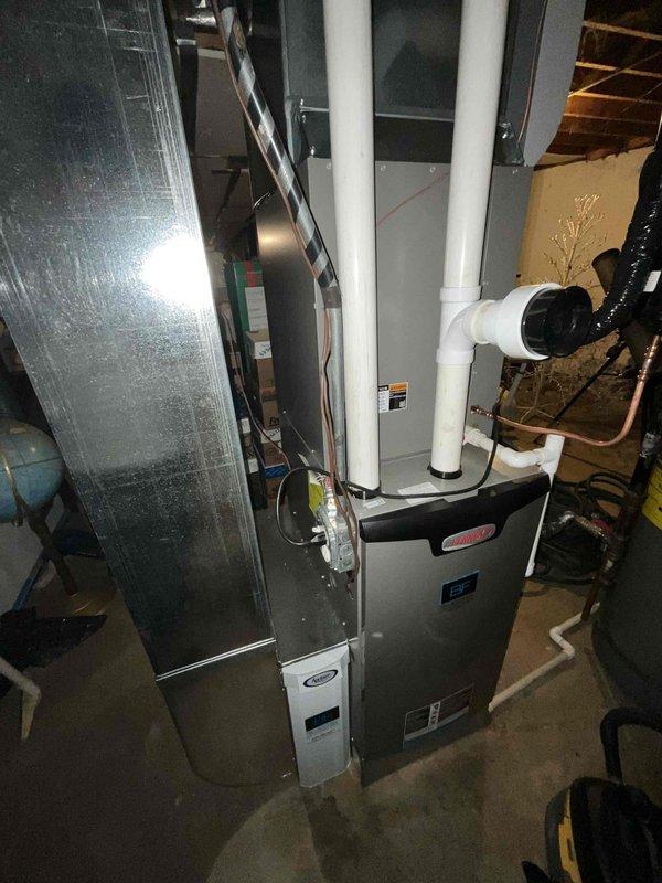 Performed comprehensive BFMA tune-up service on residential HVAC system located in basement utility area, including inspection and maintenance of Rheem water heater and furnace unit. Completed scheduled filter replacement (#213) and verified proper operation of all system components including condensate drainage, ventilation, and ductwork connections.