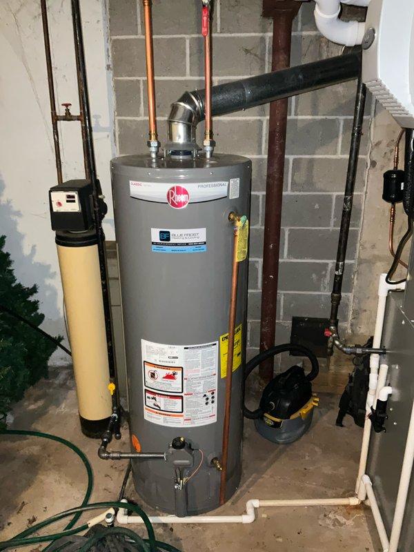 Performed comprehensive BFMA tune-up service on residential HVAC system located in basement utility area, including inspection and maintenance of Rheem water heater and furnace unit. Completed scheduled filter replacement (#213) and verified proper operation of all system components including condensate drainage, ventilation, and ductwork connections.