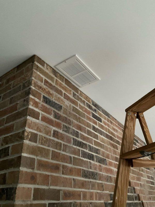 Completed retrofit ductwork installation by mounting 3 4x10 and 2 4x12 sidewall registers along with 2 6x12 return grilles as specified. Inspected and reconnected the customer-reported disconnected float switch. All registers and grilles were properly positioned and secured after drywall completion, ensuring proper airflow throughout the space featuring exposed brick walls and ceiling beams.