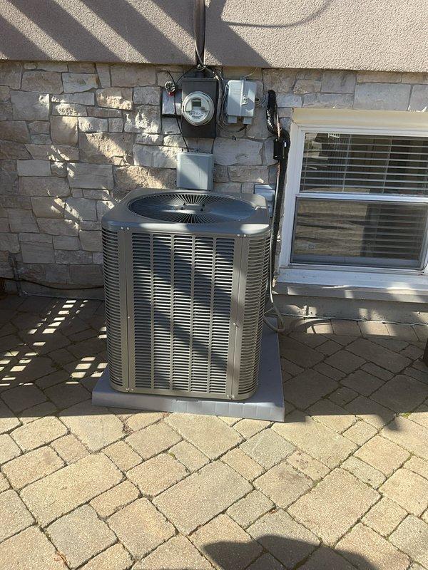 Successfully installed and commissioned new AC system with proper electrical connections. Installed 20A2P Square D circuit breaker and verified complete system operation per installation worksheet. System includes 10-year labor and parts warranty coverage.