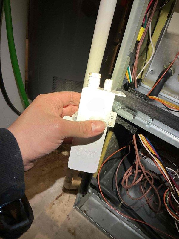 Performed maintenance tune-up on a 7-year-old furnace system. Inspected and cleaned internal components including electrical connections and condensate trap. Replaced severely clogged air filter which showed significant dust accumulation, improving system airflow and efficiency.